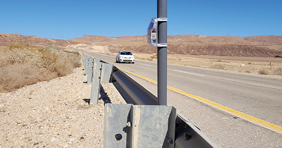 An “acoustic curtain” device installed on the side of a road.