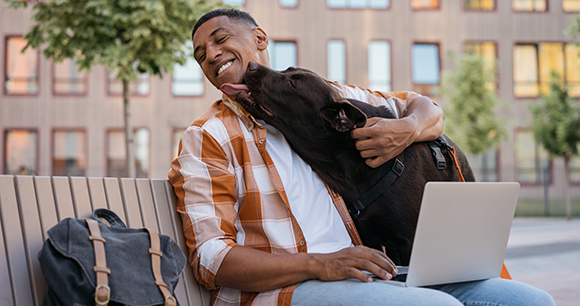 college student and dog on campus