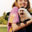 Child holding a primate.