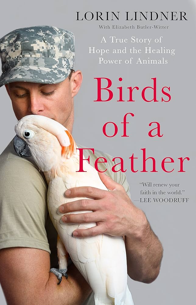 army soldier caresses big white cockatoo