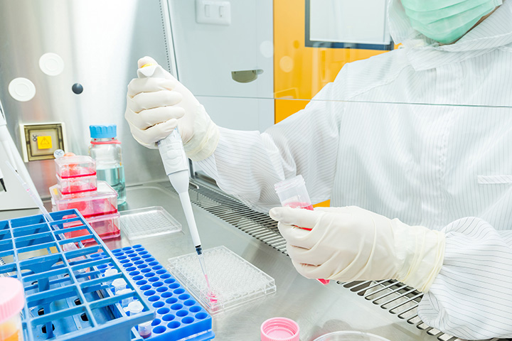 a researcher conducts an experiment in a laboratory