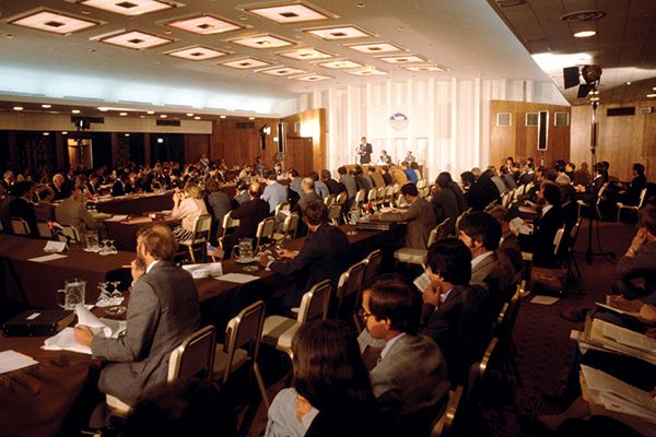 A large conference room is filled with attendees of the meeting of the International Whaling Commission.