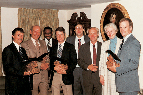 Christine Stevens stands with recipients of the Clark R. Bavin Wildlife Law Enforcement Awards.